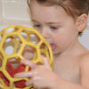 Toddler Playing With Bathtub Ball