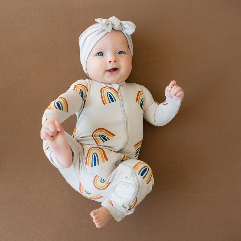 Kyte BABY Zippered Romper in Rust Rainbow on Oat